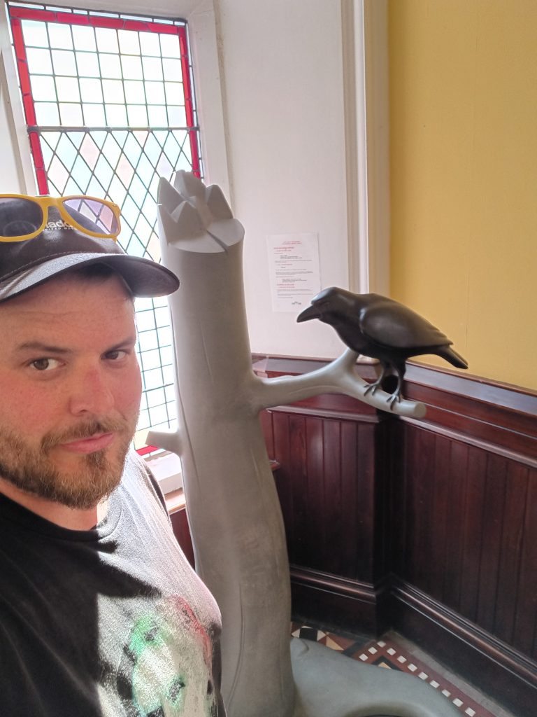 Mr. Raven Statue at Brander Library
